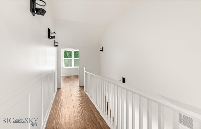 189 Blue Creek Rd, Heron, MT 59844 - corridor with wood-type flooring, lofted ceiling, and an upstairs landing