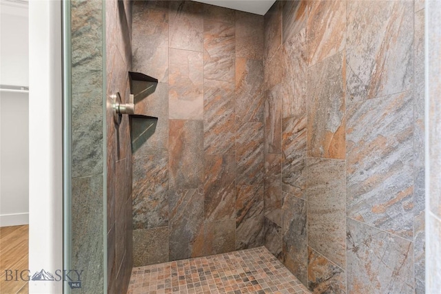 189 Blue Creek Rd, Heron, MT 59844 - full bath featuring tiled shower and wood finished floors
