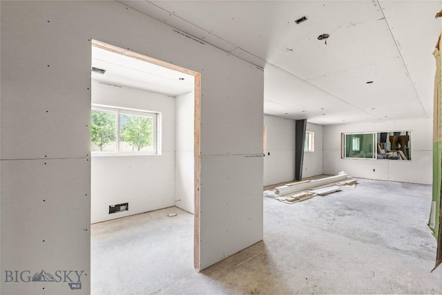 189 Blue Creek Rd, Heron, MT 59844 - spare room with plenty of natural light and unfinished concrete flooring