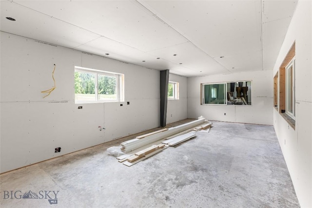 189 Blue Creek Rd, Heron, MT 59844 - unfurnished room with healthy amount of natural light and unfinished concrete floors