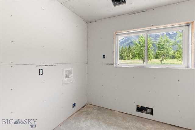 189 Blue Creek Rd, Heron, MT 59844 - spare room with healthy amount of natural light and unfinished concrete flooring