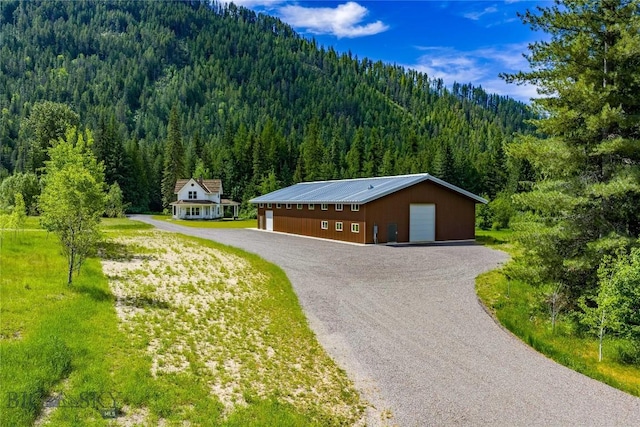 189 Blue Creek Rd, Heron, MT 59844 - detached garage with a wooded view