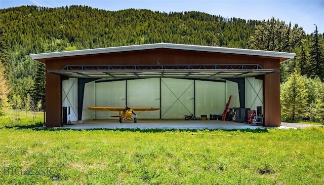 189 Blue Creek Rd, Heron, MT 59844 - view of outdoor structure featuring a forest view and a detached carport
