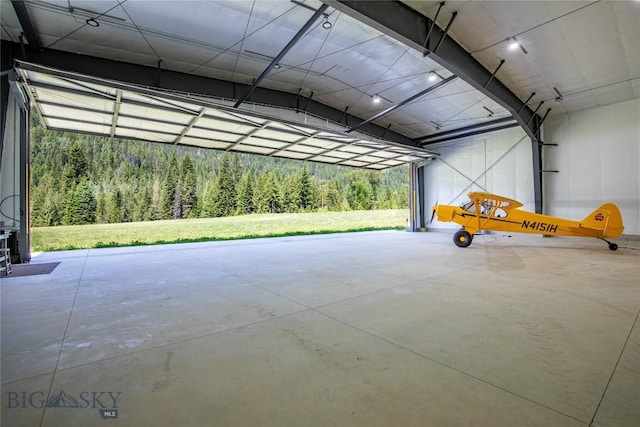189 Blue Creek Rd, Heron, MT 59844 - garage featuring a view of trees