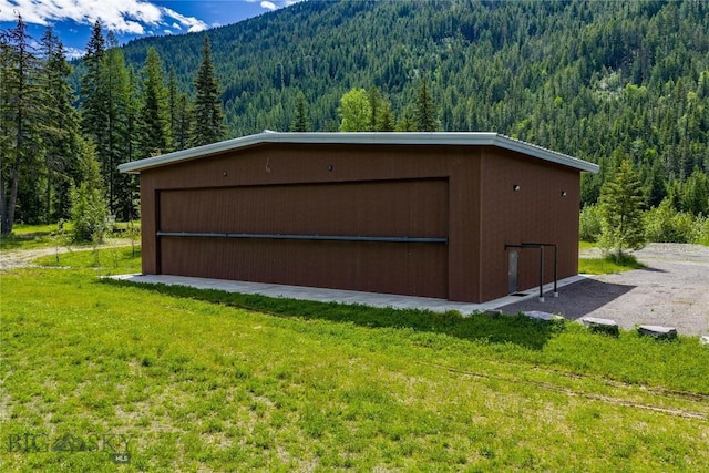 189 Blue Creek Rd, Heron, MT 59844 - view of outdoor structure with a wooded view and a mountain view