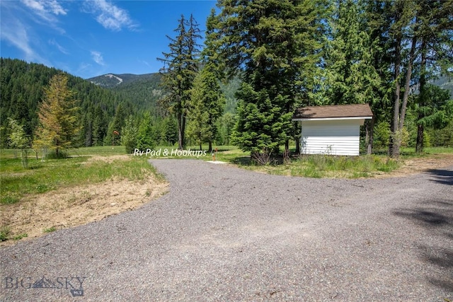 189 Blue Creek Rd, Heron, MT 59844 - view of road with a wooded view and a mountain view