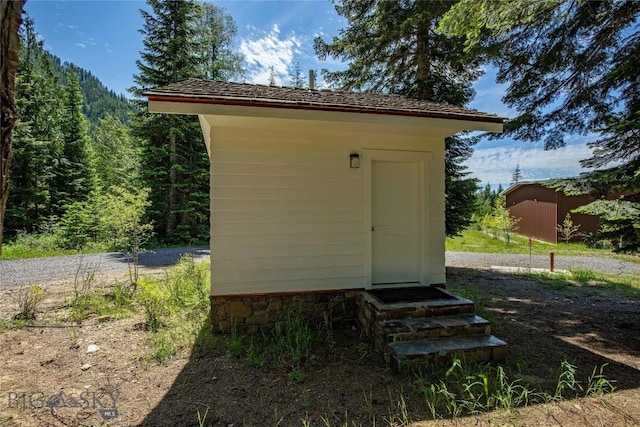189 Blue Creek Rd, Heron, MT 59844 - view of shed with entry steps and a forest view