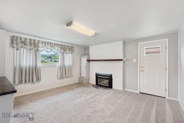 225 Mountain View Dr S, Anaconda, MT 59711 - unfurnished living room featuring a brick fireplace and carpet flooring