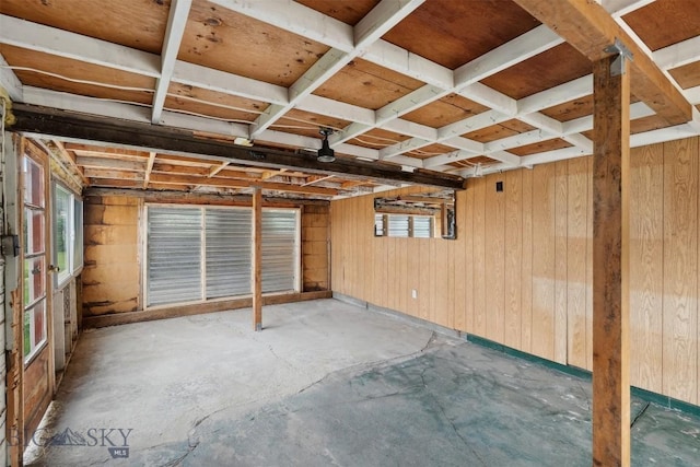 225 Mountain View Dr S, Anaconda, MT 59711 - empty room with unfinished concrete flooring and wooden walls
