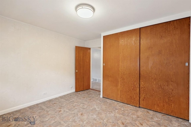 225 Mountain View Dr S, Anaconda, MT 59711 - unfurnished bedroom featuring a closet and baseboards