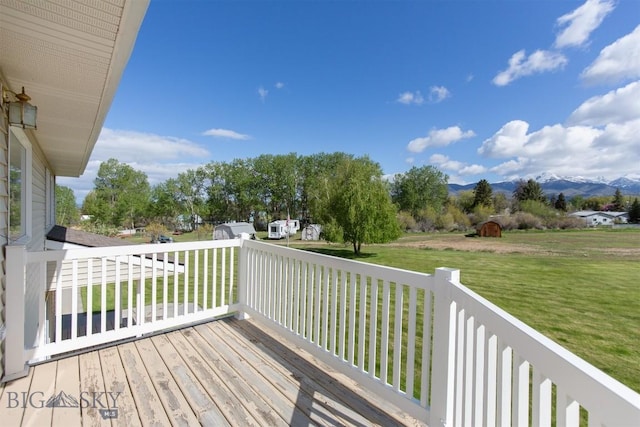 507 E Poppleton, Sheridan, MT 59749 - deck featuring a mountain view and a lawn