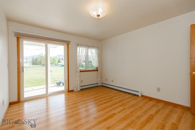507 E Poppleton, Sheridan, MT 59749 - spare room featuring light wood finished floors and baseboard heating