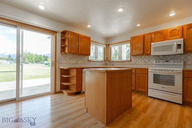 507 E Poppleton, Sheridan, MT 59749 - kitchen featuring white appliances, open shelves, light wood-type flooring, and recessed lighting