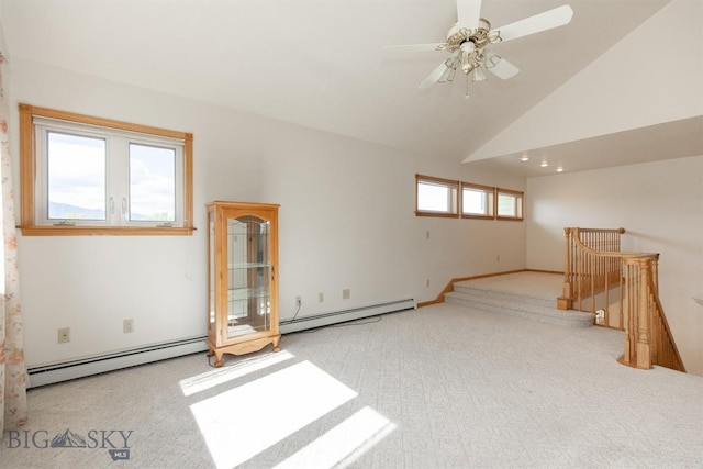 507 E Poppleton, Sheridan, MT 59749 - carpeted empty room featuring a baseboard heating unit, ceiling fan, and lofted ceiling