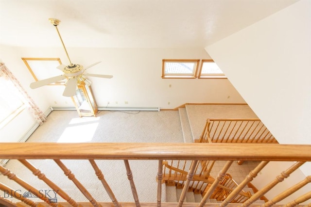 507 E Poppleton, Sheridan, MT 59749 - stairs featuring a ceiling fan, carpet, and a baseboard heating unit
