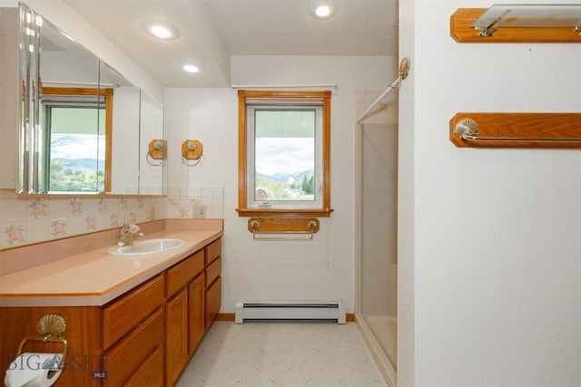 507 E Poppleton, Sheridan, MT 59749 - full bath with a baseboard radiator, healthy amount of natural light, a shower, vanity, and recessed lighting