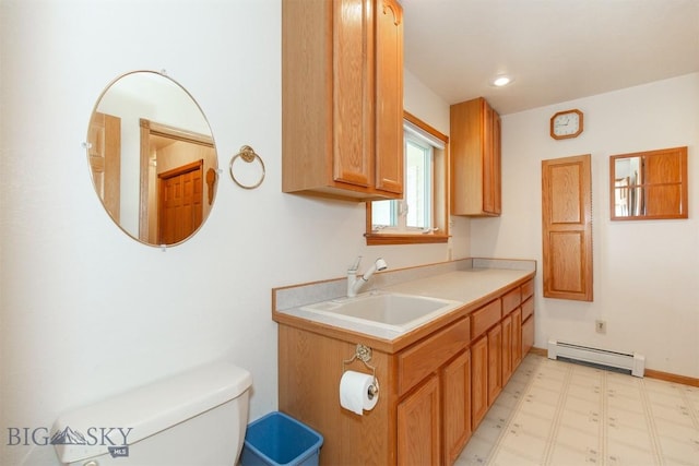 507 E Poppleton, Sheridan, MT 59749 - kitchen with a baseboard heating unit, light flooring, and light countertops