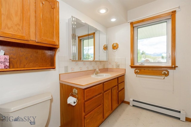 507 E Poppleton, Sheridan, MT 59749 - half bath with baseboard heating, vanity, backsplash, and recessed lighting