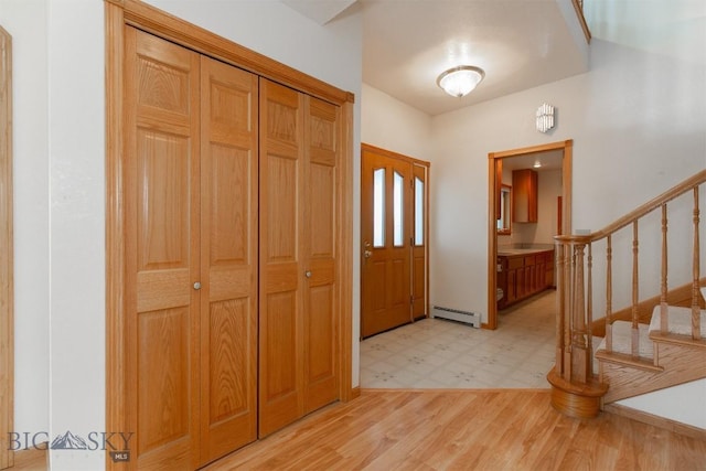 507 E Poppleton, Sheridan, MT 59749 - foyer entrance featuring baseboard heating, light flooring, and stairs
