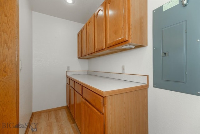 507 E Poppleton, Sheridan, MT 59749 - kitchen with electric panel, light wood-style floors, light countertops, and recessed lighting