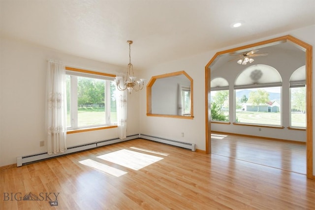507 E Poppleton, Sheridan, MT 59749 - empty room with a chandelier, a baseboard heating unit, wood finished floors, and a ceiling fan