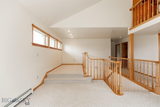 507 E Poppleton, Sheridan, MT 59749 - hallway with a baseboard heating unit, carpet flooring, an upstairs landing, and vaulted ceiling