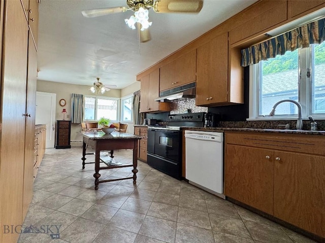 108 S 8th St, Livingston, MT 59047 - kitchen with dishwasher, under cabinet range hood, black / electric stove, ceiling fan, and brown cabinets