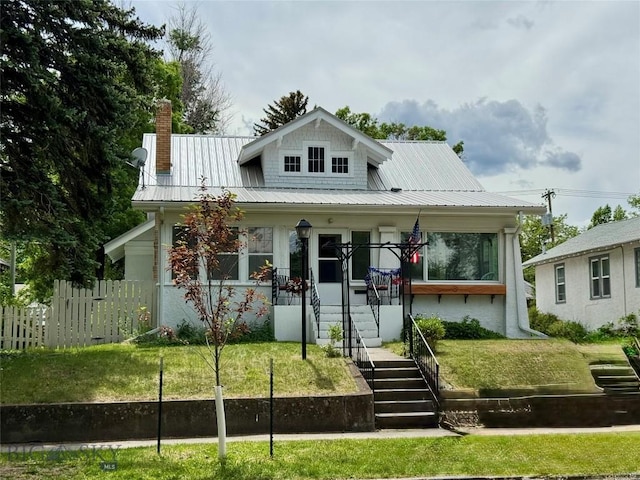 108 S 8th St, Livingston, MT 59047 - bungalow-style house featuring covered porch, a chimney, a metal roof, and stairway