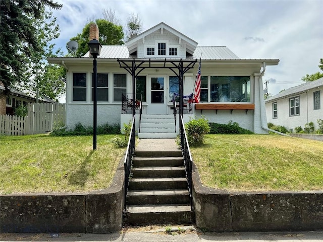 108 S 8th St, Livingston, MT 59047 - view of front facade with a metal roof, stairs, and a chimney