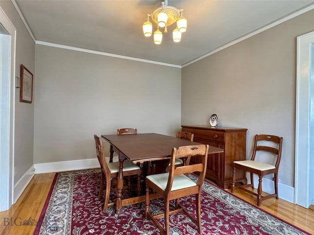 108 S 8th St, Livingston, MT 59047 - dining area featuring crown molding, light wood-style flooring, and a chandelier