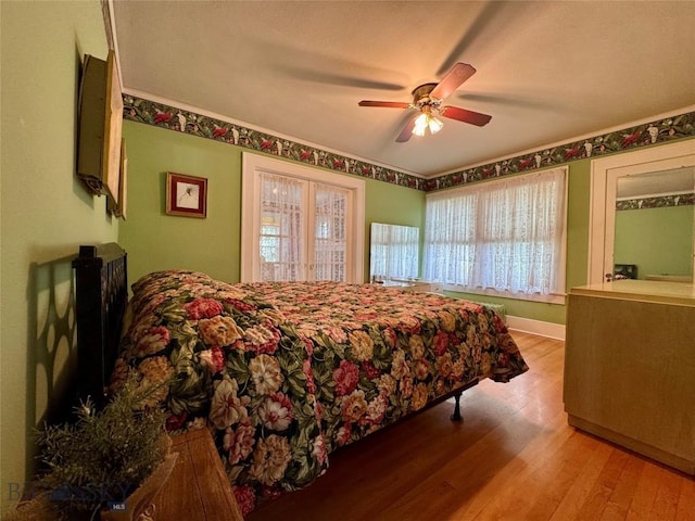 108 S 8th St, Livingston, MT 59047 - bedroom with wood finished floors and a ceiling fan
