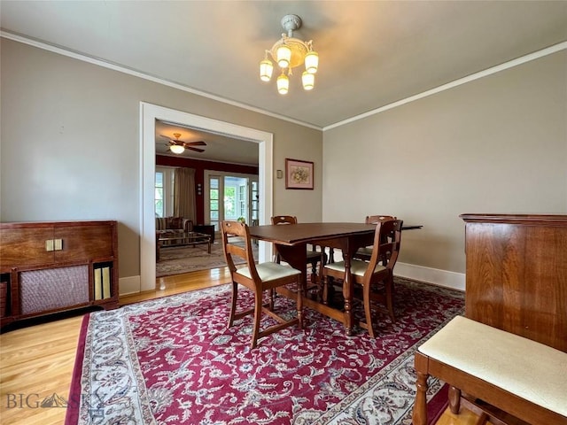 108 S 8th St, Livingston, MT 59047 - dining room with ornamental molding, wood finished floors, and a chandelier