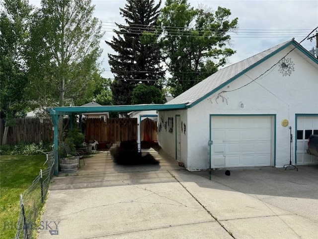 108 S 8th St, Livingston, MT 59047 - garage featuring a carport and driveway