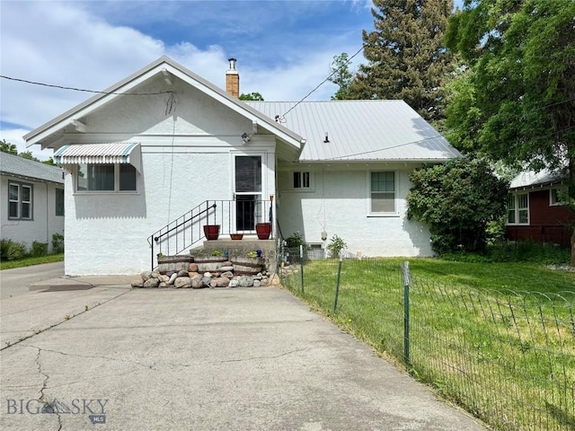 108 S 8th St, Livingston, MT 59047 - bungalow-style home with a chimney and stucco siding