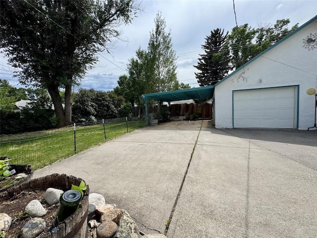 108 S 8th St, Livingston, MT 59047 - garage featuring driveway and a carport