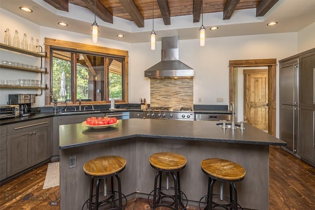 2055 Ousel Falls Rd, Big Sky, MT 59716 - kitchen featuring wall chimney range hood, dark countertops, recessed lighting, dark wood-style floors, and a wood ceiling with exposed beams