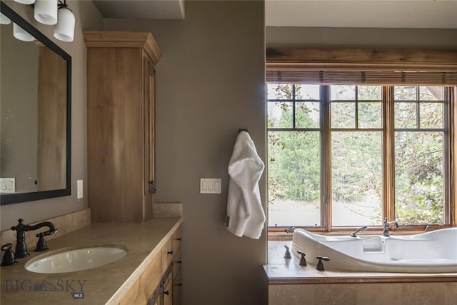 2055 Ousel Falls Rd, Big Sky, MT 59716 - full bathroom featuring plenty of natural light, vanity, and tiled tub