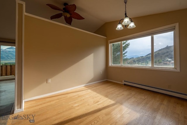 3 Evening Star Dr, Emigrant, MT 59027 - empty room with light wood-style floors, a baseboard heating unit, ceiling fan, lofted ceiling, and a chandelier