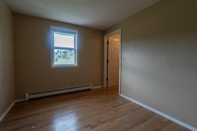 3 Evening Star Dr, Emigrant, MT 59027 - empty room with baseboard heating and wood finished floors