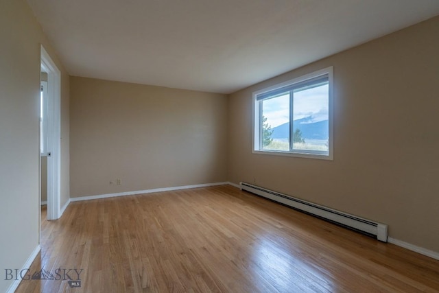 3 Evening Star Dr, Emigrant, MT 59027 - empty room featuring a baseboard radiator and light wood-style flooring