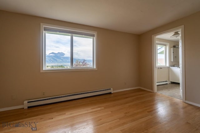 3 Evening Star Dr, Emigrant, MT 59027 - empty room with a baseboard radiator and light wood-type flooring
