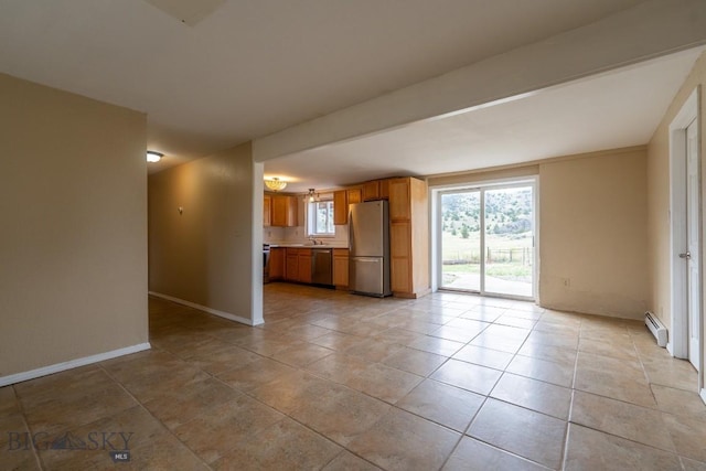 3 Evening Star Dr, Emigrant, MT 59027 - unfurnished living room featuring baseboard heating and light tile patterned flooring