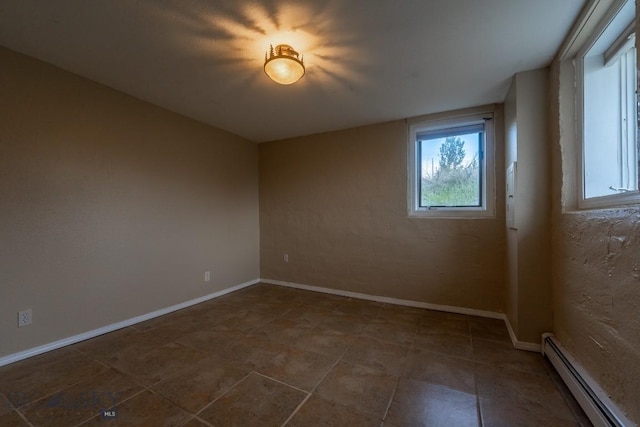 3 Evening Star Dr, Emigrant, MT 59027 - tiled spare room with a baseboard radiator and baseboards