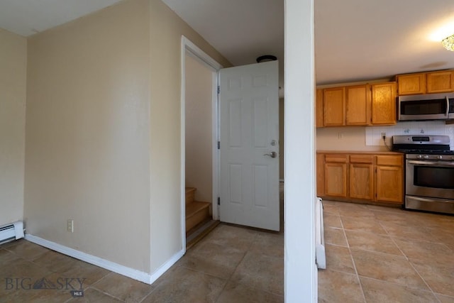 3 Evening Star Dr, Emigrant, MT 59027 - kitchen featuring stainless steel appliances, brown cabinetry, light tile patterned floors, and tasteful backsplash
