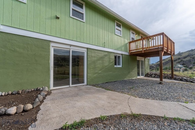 3 Evening Star Dr, Emigrant, MT 59027 - rear view of house with a patio and a deck with mountain view