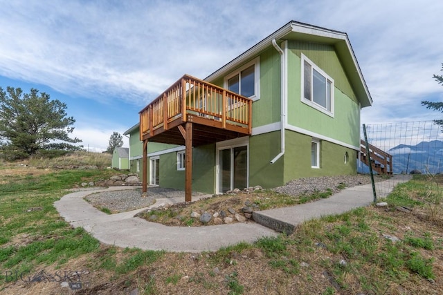 3 Evening Star Dr, Emigrant, MT 59027 - rear view of house with a wooden deck and stairs