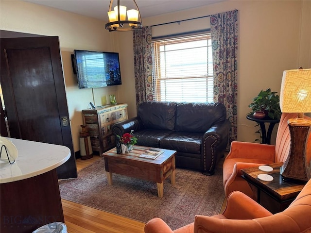 201 W Park St Unit 410, Livingston, MT 59047 - living area featuring a chandelier and wood finished floors