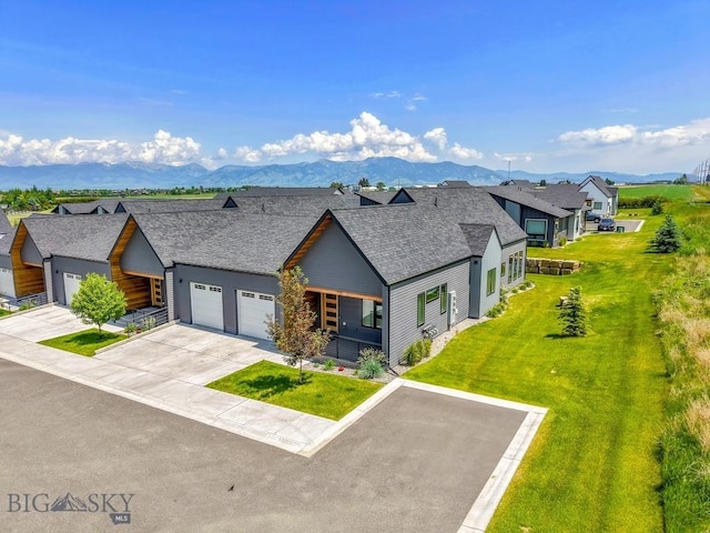 142 Albrey Trl Unit C, Bozeman, MT 59718 - contemporary home featuring a shingled roof, a garage, concrete driveway, a front yard, and a mountain view