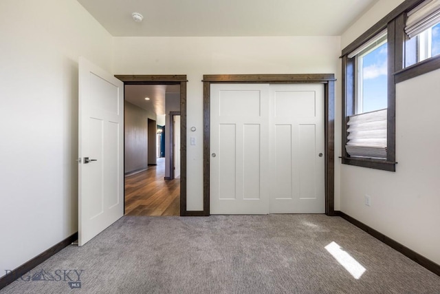 142 Albrey Trl Unit C, Bozeman, MT 59718 - unfurnished bedroom with carpet floors and a closet