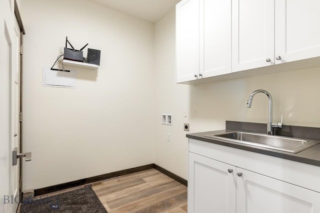 142 Albrey Trl Unit C, Bozeman, MT 59718 - laundry area with electric dryer hookup, hookup for a washing machine, light wood finished floors, and cabinet space